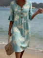 Detail view of the elegant linen casual dress featuring floral embroidery and wooden buttons. - S / Dresses / Light Blue Coconut Tree Print