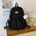 Mochila escolar casual negra, bolso de viaje grande de color liso con colgante bonito. - Bolso Simple Pequeño / Negro
