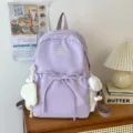 Light purple casual backpack for women, cute bow design, large capacity nylon school bag. - Purple
