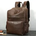 Klassieke donkerbruine echt lederen heren business rugzak met meerdere zakken voor onderweg. - koffiekleur