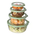 Clear PET airtight round food storage container set of four with green lids for kitchen organization. - Green