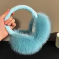Fluffy winter earmuffs in light blue, soft plush ear warmers for cold weather outdoor wear. - ER - Blue Plush Earmuffs