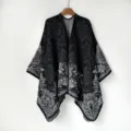Close-up of the elegant black and white knitted paisley pattern on this warm winter travel shawl. - MZP033-Black