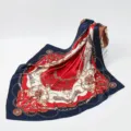 Detail view of a luxurious square silk scarf featuring a chic chain and belt baroque print. - 90x90cm / 13