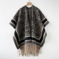 Detailed view of the leopard print poncho shawl featuring chic fringe hem and contrast stripes. - 180*100cm / FRP049 - Coffee