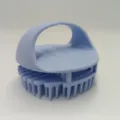 Ergonomic silicone scalp massager and shampoo brush in light blue for daily hair care. - Blue