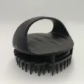 Black silicone scalp massage shampoo brush with handle for hair washing and scalp care. - Black