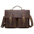Vista dettagliata della borsa a tracolla vintage in pelle marrone con tasche anteriori. - Marrone