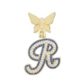 Nahaufnahme des goldenen Buchstabenanhängers mit funkelnden weißen und blauen Zirkoniasteinen. - Buchstabe R