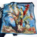 Detail view of oil painting floral print silk square scarf with elegant blue border. - Van Gogh Gladioli
