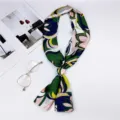Elegant long skinny silk scarf with chic abstract floral print for women neck and bag decor. - Fantasy Floral Green