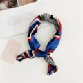 Detailed view of a chic geometric silk neck scarf, stylish accessory for women in spring. - Wave