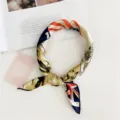 Close-up detail of stylish small square silk scarf with fashionable flag print design. - National Flag