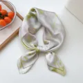 Lightweight silk square scarf with elegant floral pattern, perfect for spring summer styling. - Dreamy Green Leaves