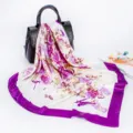 Detailed view of a satin floral silk scarf draped elegantly, showing smooth texture and print. - D9029-Purple