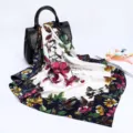 Detailed view of luxury satin floral silk scarf with elegant typography design in a studio setting. - D9028-Blue
