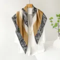 Detailed shot of a luxury satin square scarf featuring elegant lace geometric patterns. - Black Border Lace