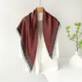 Close-up detail view of the vintage red patterned satin square scarf elegantly draped. - Vintage Small Square
