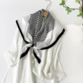 Elegant black and white striped satin square scarf for women, lightweight chic silk feel. - Letter Anagram Pattern