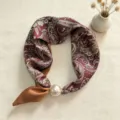 Silk scarf detail view, elegant paisley pattern with large pearl magnetic clasp accessory. - CXK005-Wine Red Paisley