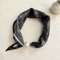 Closeup of black white paisley silk scarf with large pearl magnetic buckle elegant accessory - CXK005-Black Small Paisley