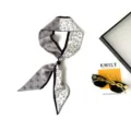 Detailed view of black and white skinny silk twilly scarf with elegant horse and butterfly print. - Steed and Butterfly Shadow