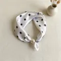 Detail shot of elegant white polka dot silk scarf with pearl magnetic clasp closure. - CXK004-White Polka Dots