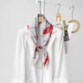 Elegant magnetic silk scarf detail showing plaid pattern and red accent on white blazer. - CXK010 - Classic Plaid Red