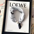 Chic silk scarf featuring a pearl magnetic buckle and stylish chain print design. - CXK007-White Island Sketch