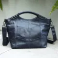 Dark blue leather patchwork handbag with metal pyramid studs and top handle for women stylish daily commute - Sapphire Blue