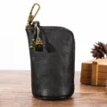 Astuccio per chiavi in pelle vintage nera con gancio in metallo e cerniera, elegante e pratico. - Nero