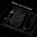 Detail of all-black men's quartz watch and matching jewelry set in matte finish. - Set 5