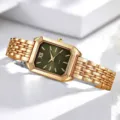 Nahaufnahme einer eleganten Quarzuhr mit grünem Zifferblatt und Goldband - Nur Uhr Stil / Goldfarbe Grün