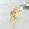 Luxurious gold-tone women's quartz wristwatch featuring full rhinestone paving on band and bezel - Gold Number Dial Watch