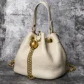 Stylish genuine leather bucket bag with gold chain and metal ball decoration for women. - White