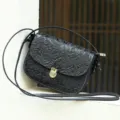 Black embossed leather shoulder bag, vintage crossbody bag with floral design. - Black Embossed