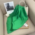 Elegant solid green silk scarf, smooth texture, perfect for versatile daily styling. - Emerald Green