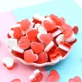 Red and white heart-shaped resin candy charms in a pink bowl for DIY craft decoration - 18x10mm / Dark Red