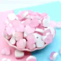 Macro view of pink and white heart resin charms for DIY slime and craft decoration. - 18x10mm / Pink