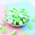Detailed macro view of green heart-shaped resin charms for DIY slime and craft decoration - 18x10mm / Green