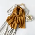 Mustard yellow pleated long scarf with elegant textured cotton-silk feel for women. - Turmeric