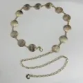 Gold metal waist chain detailed with textured round discs and adjustable links for dresses. - Round Waist Chain / Gold
