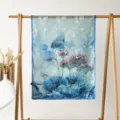 Detail shot of blue long silk scarf with floral botanical print displayed on wooden rack. - Blue Lotus Pond