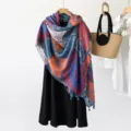 Detailed view of ethnic paisley shawl with vivid tassels and patchwork design and nice drape. - Ethnic