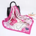 Detail view of a 90cm satin silk scarf featuring elegant chain and tassel prints for women. - D9033-Rose Red