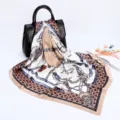 Detailed close-up view of luxury satin silk scarf featuring elegant chain and belt print design. - D9035-Khaki