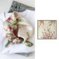 Silk floral square scarf detail showing delicate blossom print and elegant green border. - Green Edge Peach Blossom