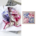 Silk square scarf detail featuring delicate blue and pink floral watercolor print design. - Blue Pink Floral