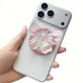 Macro detail showing iridescent butterfly pop socket attached to white smartphone back - Magnetic Stand / Pink