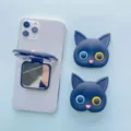 Detail showing the cat-shaped phone grip opened as a vanity mirror on a smartphone. - Cat Shape (Grip Stand) / Black